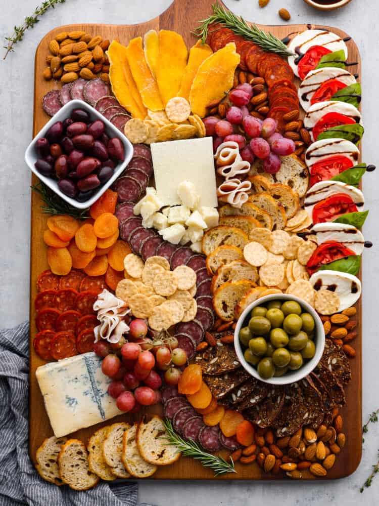 An overview of the Italian charcuterie board with an assortment of meats, cheeses, nuts, and fruits.