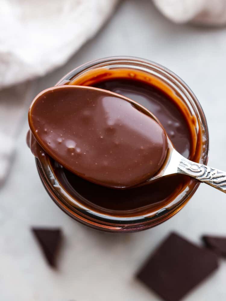 A spoon showing the hot fudge.