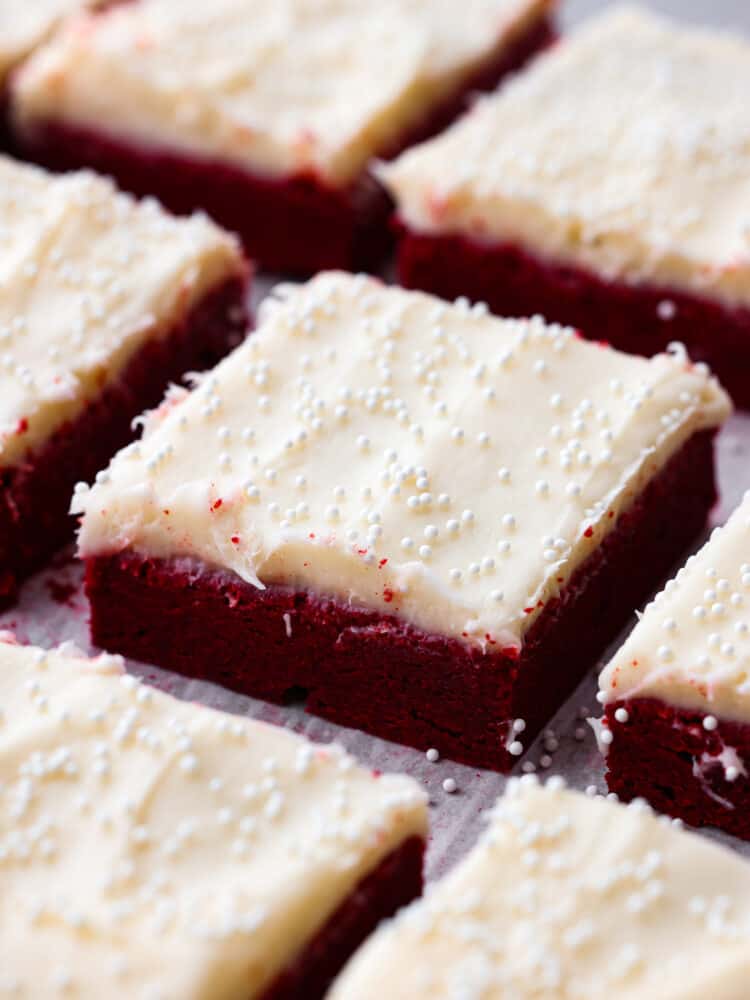 Red velvet sugar cookie bars cut into squares.