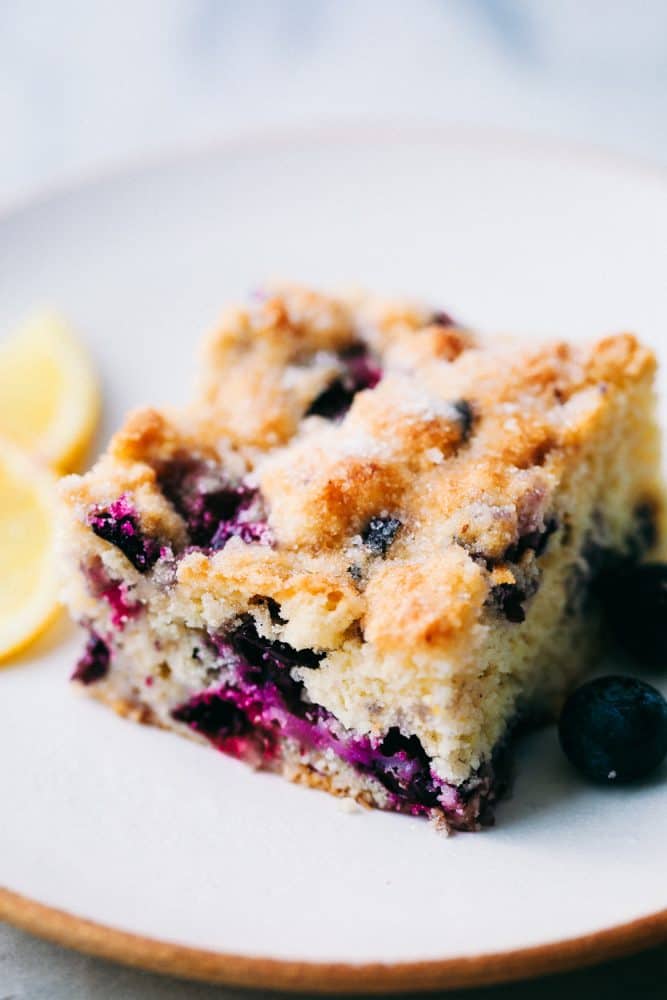 Close up of a slice of blueberry breakfast cake.