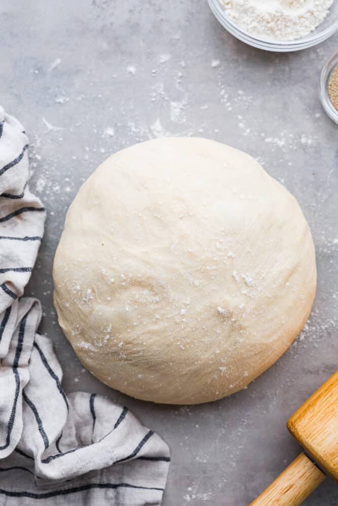 Pizza dough rolled into a ball.