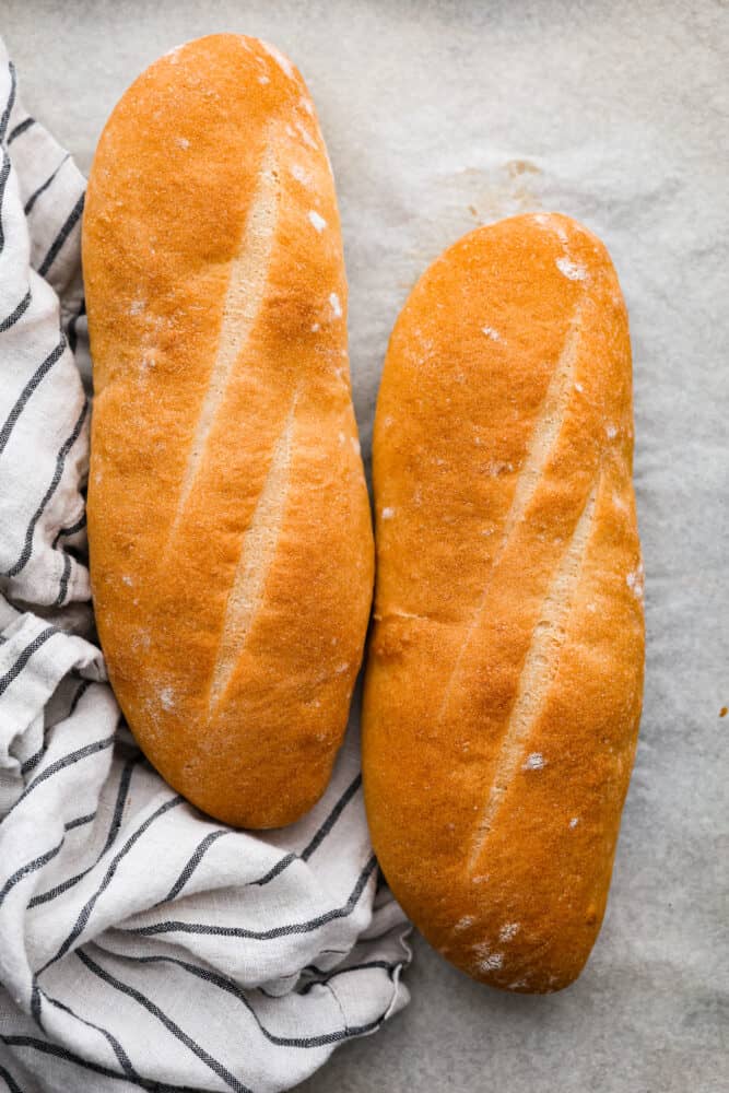 An overhead view of two loaves of Italian bread.