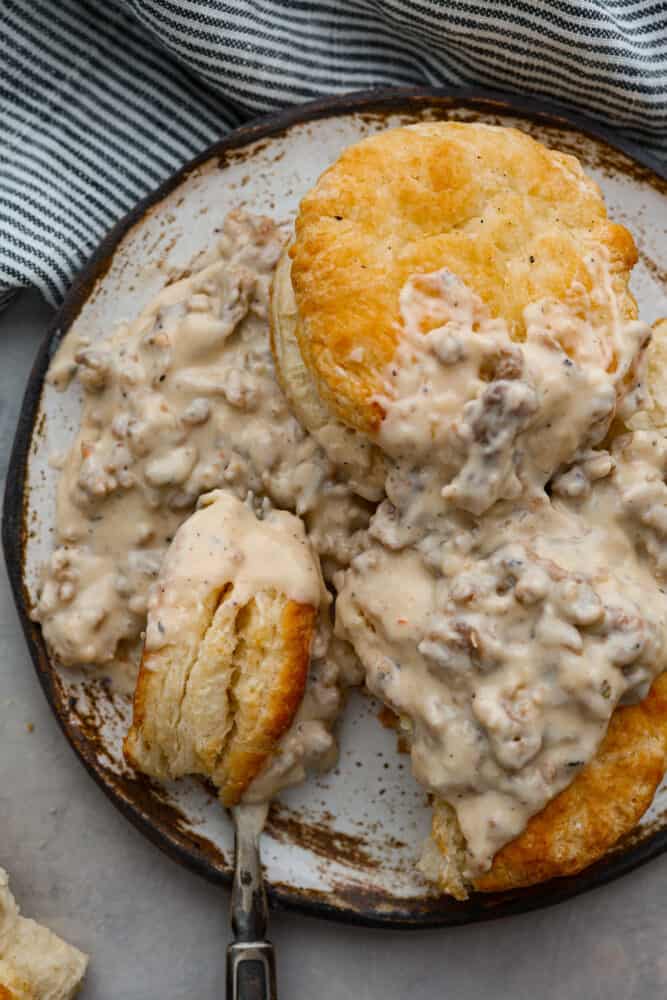 An overhead view of the biscuits and gravy on a plate.