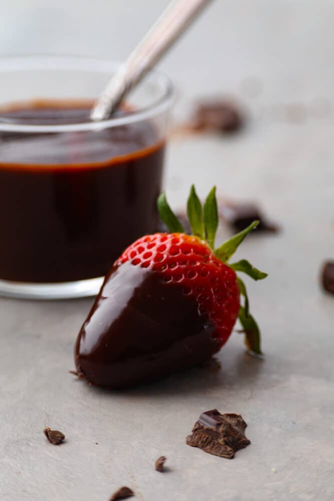 A strawberry dipped in chocolate ganache.