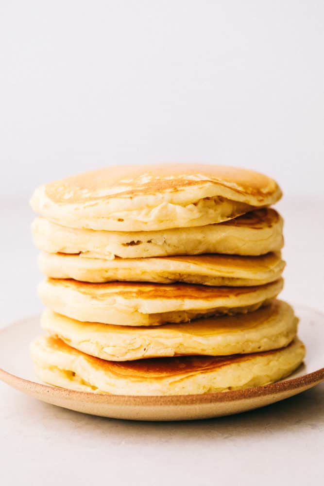 Fluffy pancakes stacked on top of each other. 
