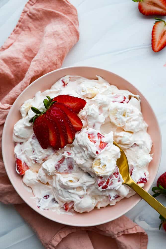 Top-down view of creamy strawberry salad.