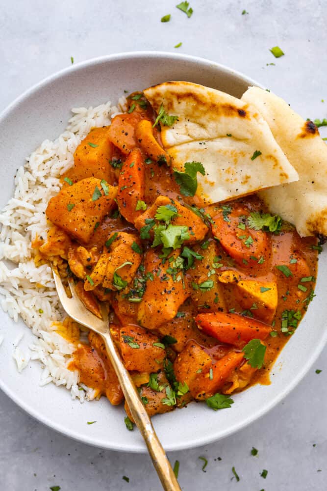 Coconut curry served over white rice with naan.