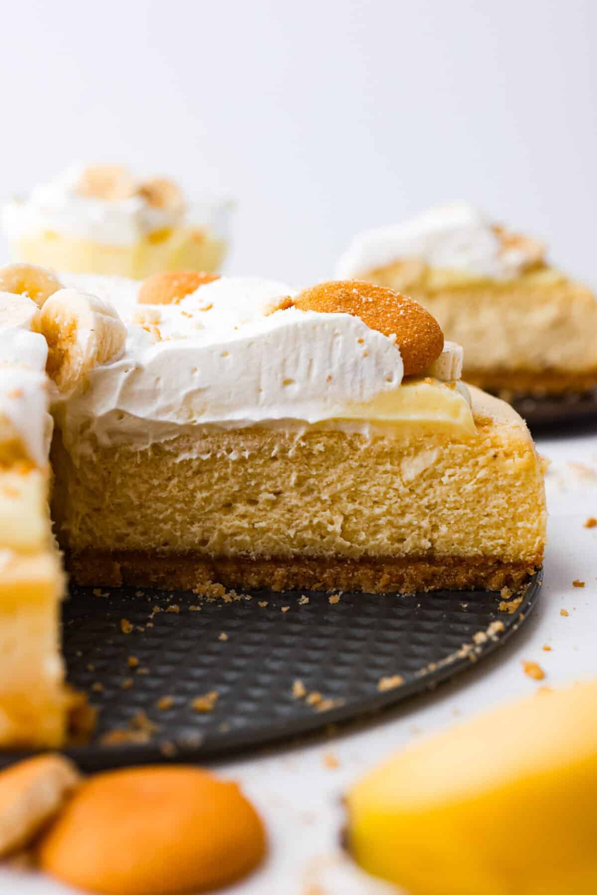 The side view of a slice of banana pudding cheesecake. 