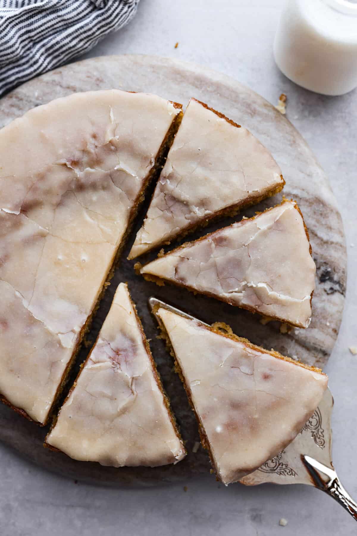 Top-down view of buttermilk cake, cut into slices.