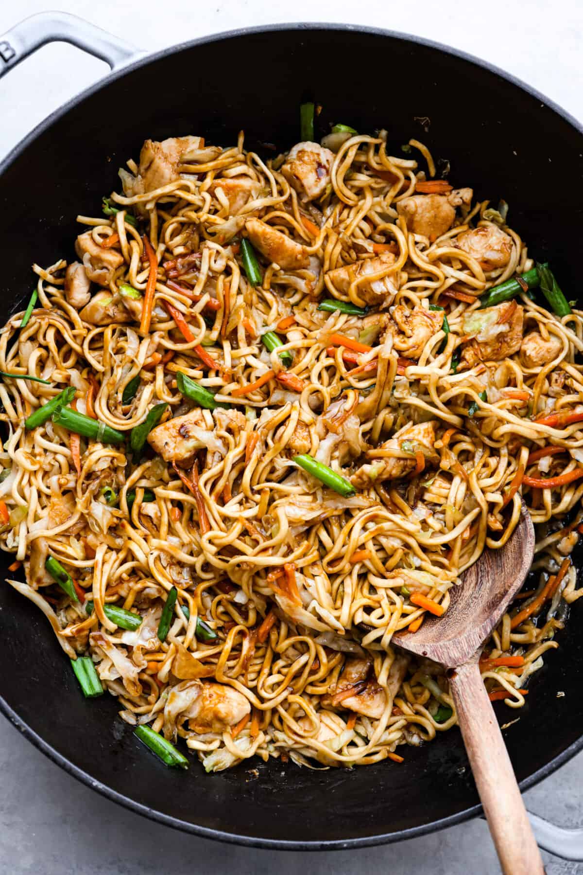 A skillet filled with chow mein.