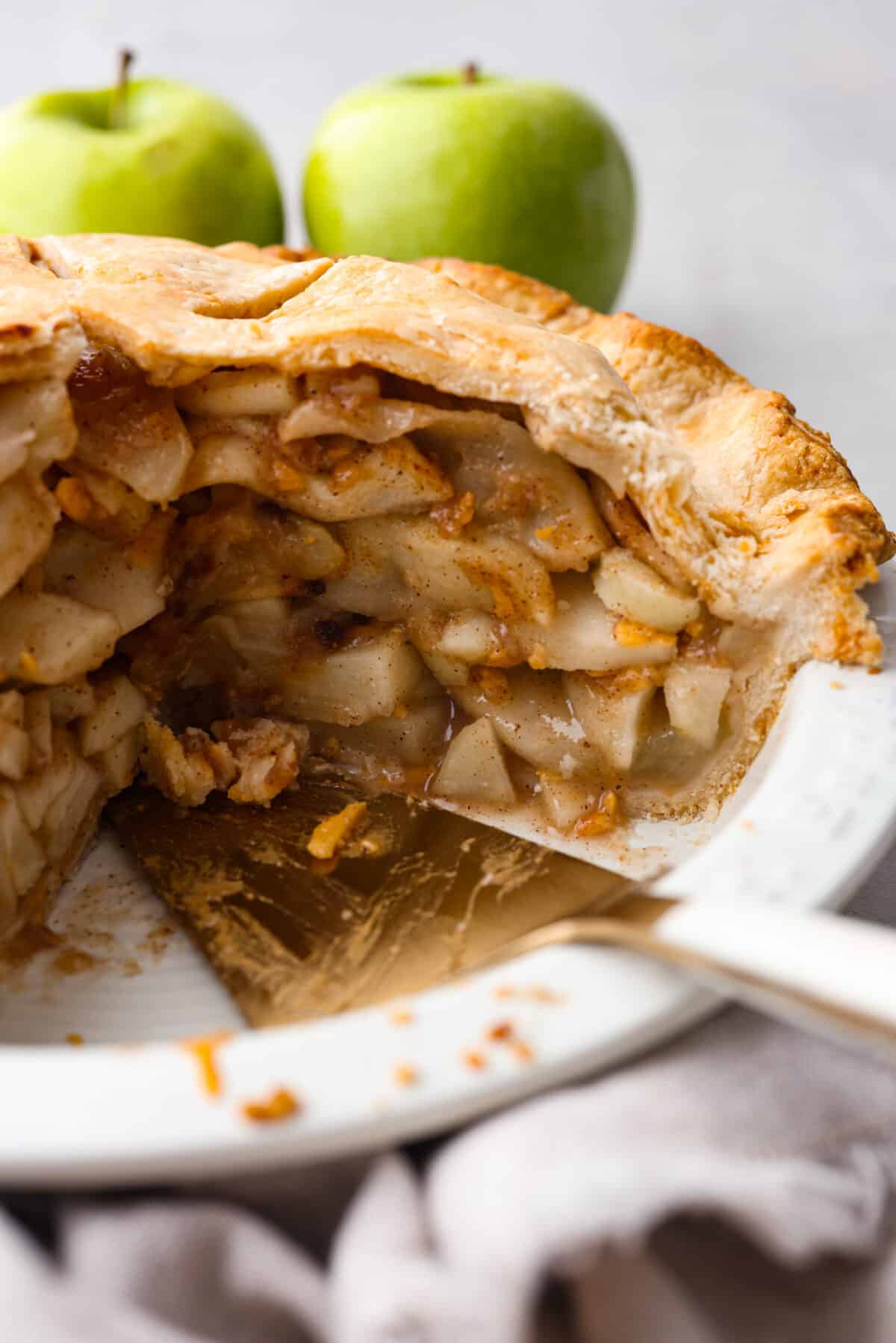 a pie with a slice taken out so that you can see all of the inside with the apple slices. 