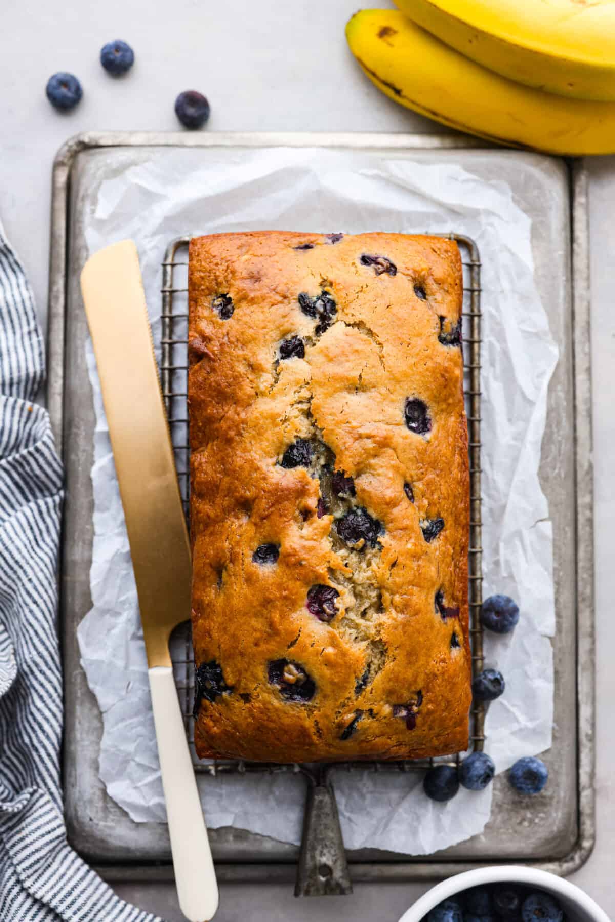 Top-down view of a loaf of blueberry banana bread.