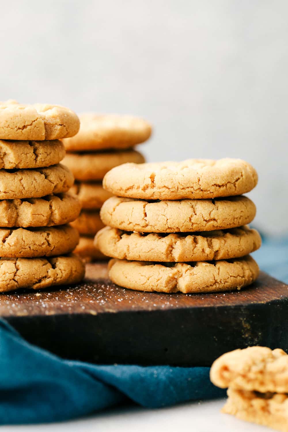 Peanut butter cookies stacked on top of each other. 