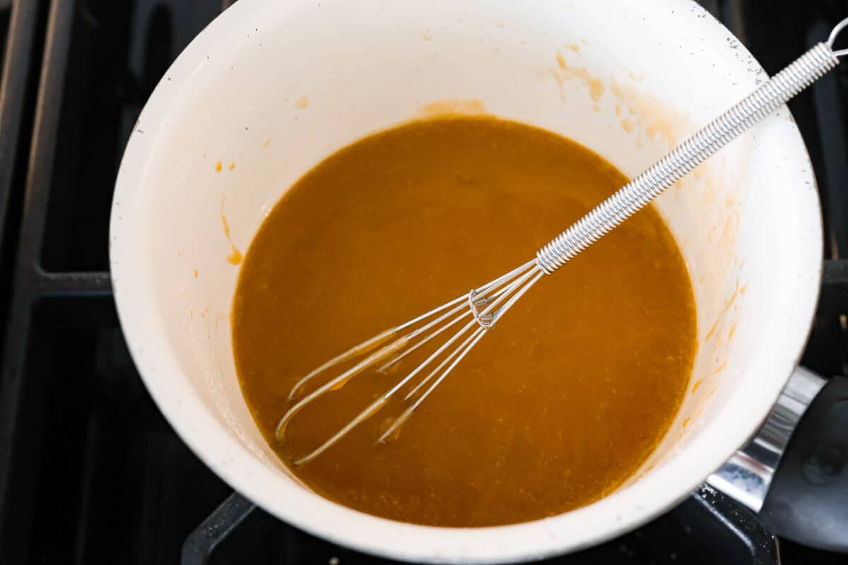 The honey glaze being whisked together.