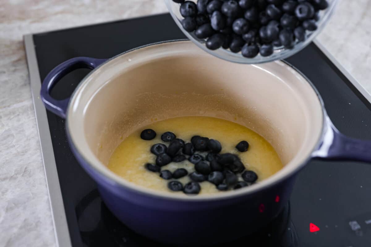 Second photo of the blueberries adding to the lemon sauce.