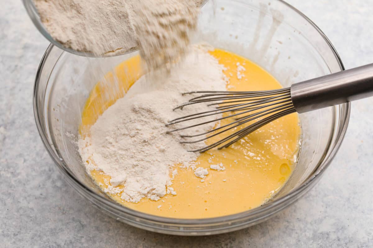 Wet and dry ingredients combined together in a bowl. 