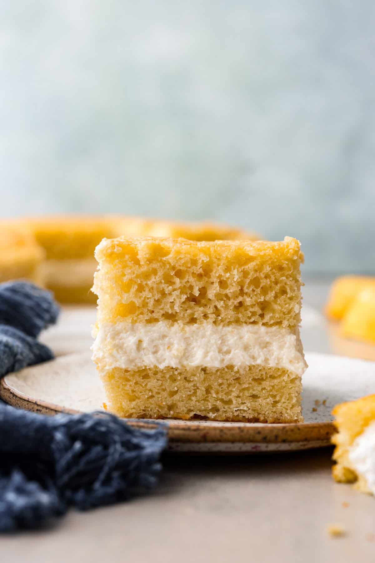 A slice of Twinkie cake on a plate. 