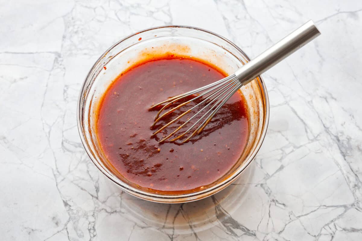 Third photo of the bbq sauce whisked in a bowl.