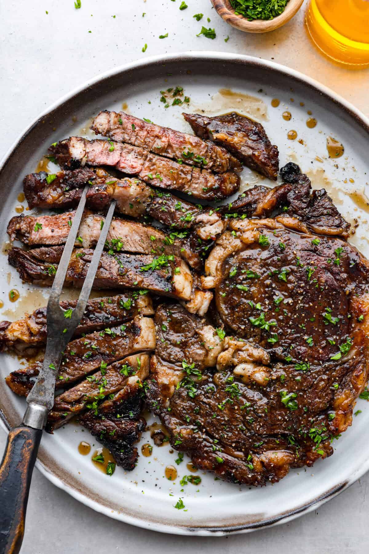 Sliced bourbon steak on a plate. 