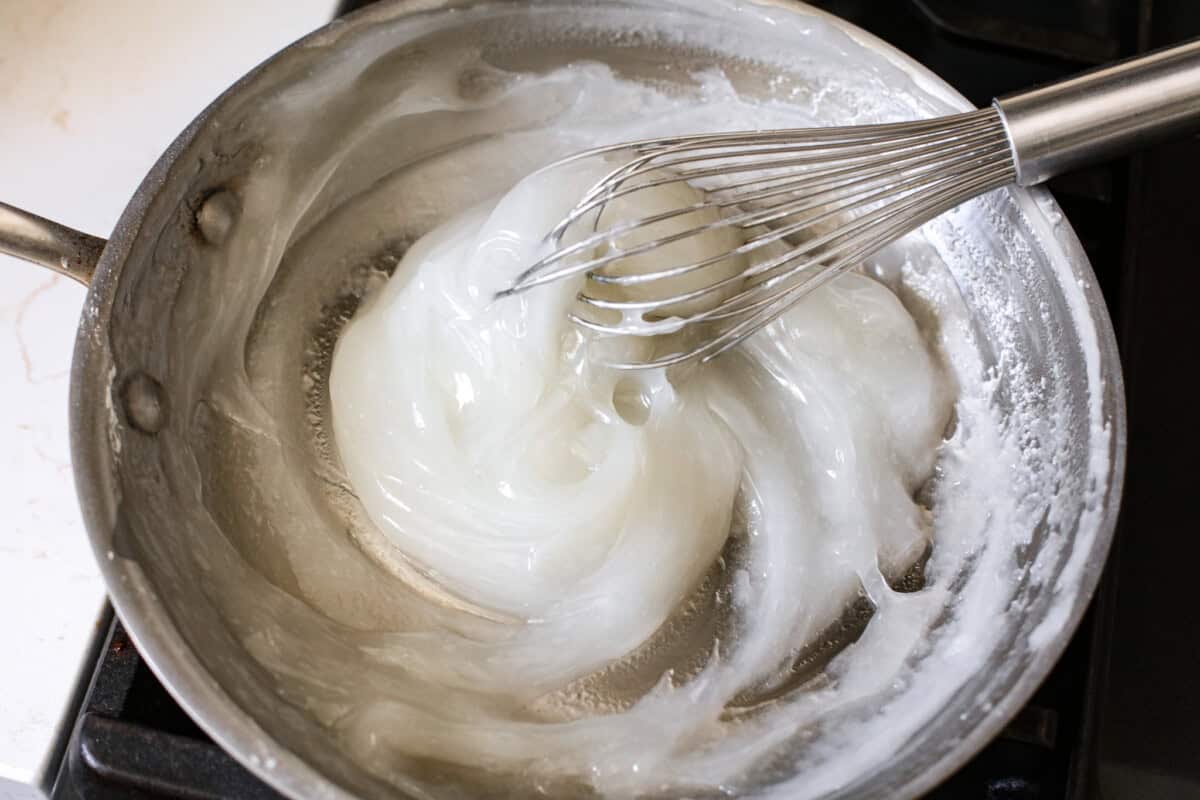 The gel and sugar being cooked over medium heat. 