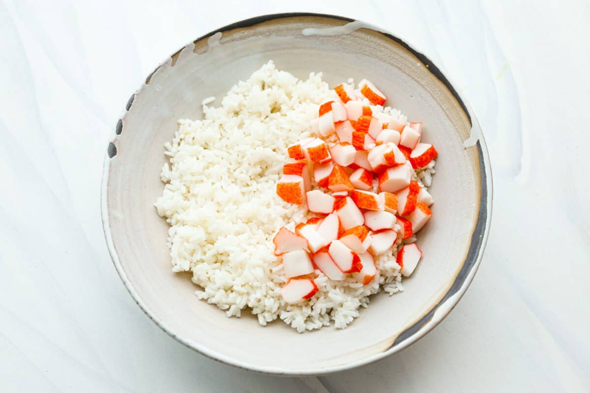 Overhead shot of bowl with rice and imitation crab. 