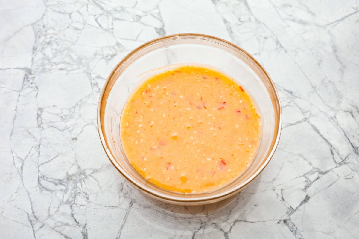 Overhead shot of mixed sauce ingredients in a bowl. 