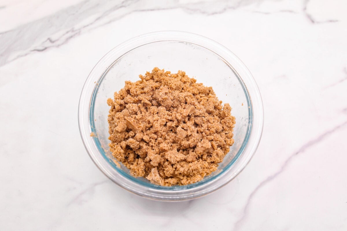 Overhead shot of flour mixture with butter cut in. 