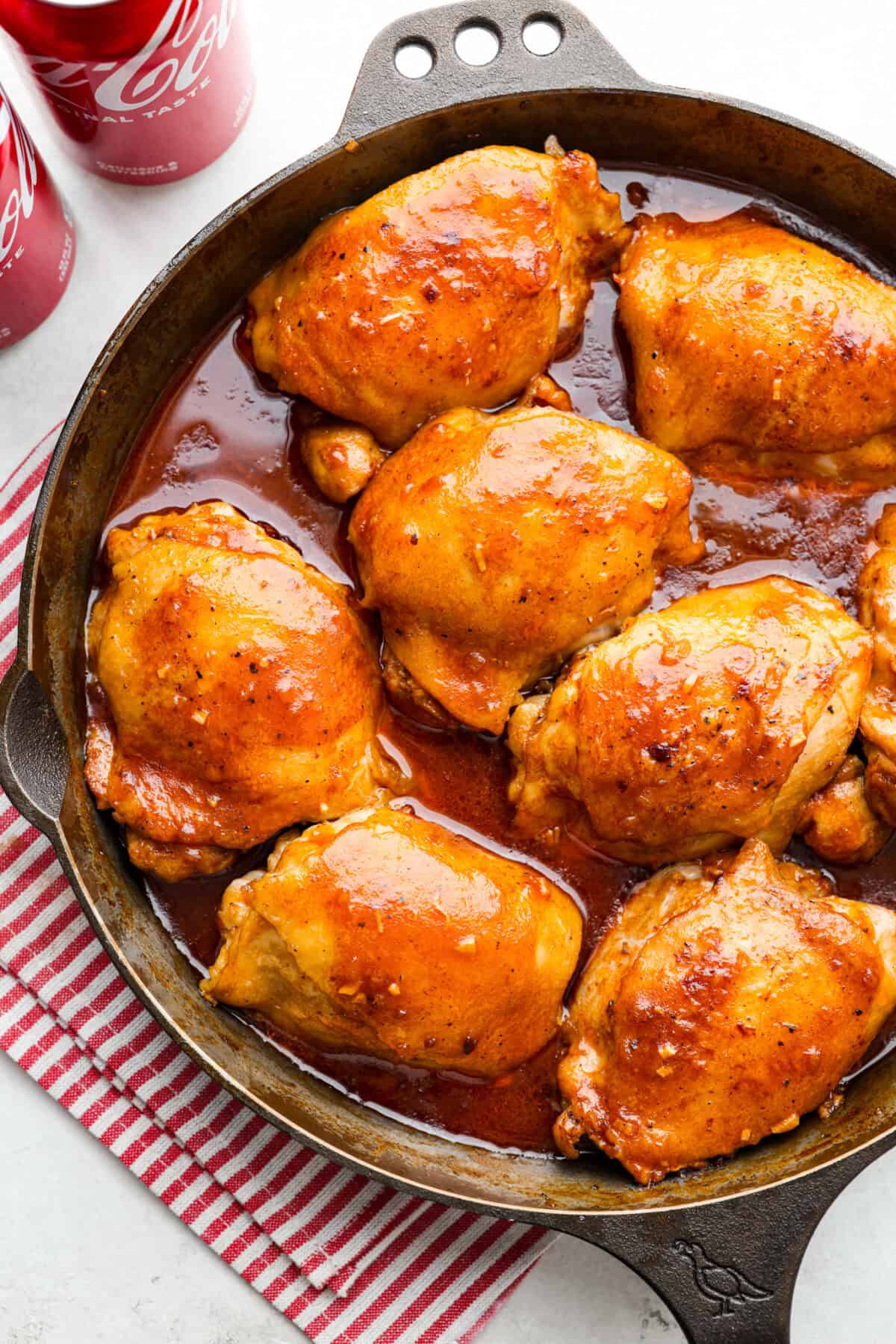 Overhead shot of coca-cola chicken in a skillet. 