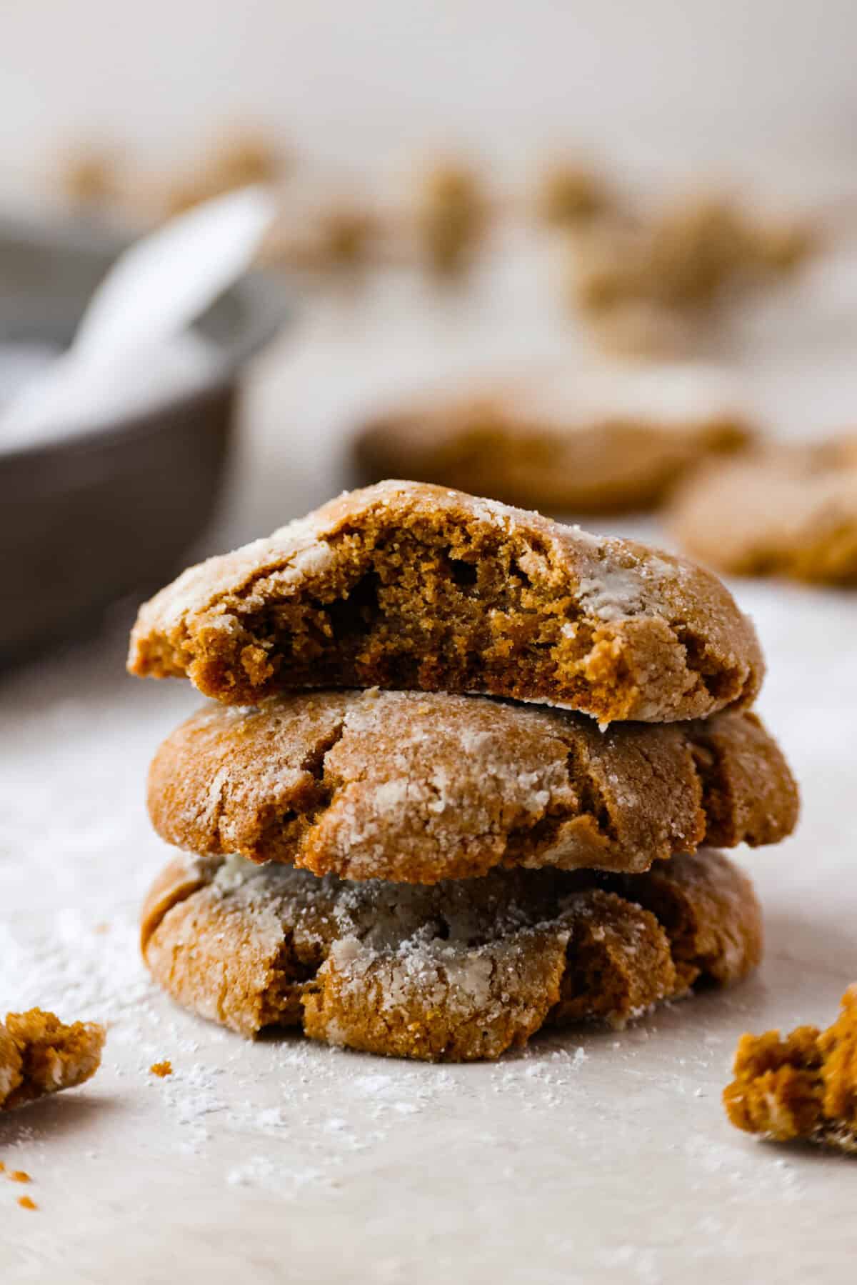 Side shot of a stack of gingerbread crinkle cookies. 