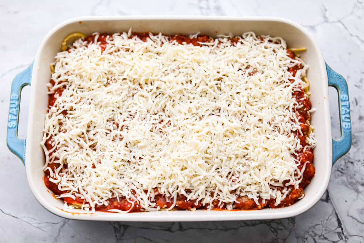 Baked spaghetti is the ultimate comfort food, with noodles that soak up all of the rich sauce as they finish cooking, making every bite extra flavorful. Plus, it’s a lifesaver on busy days. You can prep it ahead, pop it in the oven, and still have a cozy, home-cooked meal without the stress! Layer of cheese on top of the meat sauce and noodle layers.