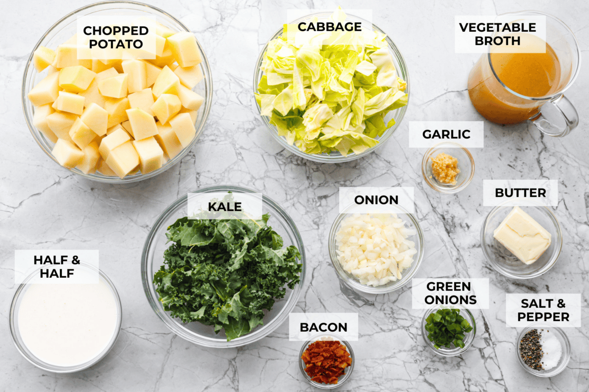 This colcannon soup is a creamy, luscious soup inspired by the traditional Irish dish that is made with potatoes, cabbage, kale, butter, and cream. This would be a great recipe to start a St. Patrick's Day tradition with your family. Overhead shot of labeled ingredients.