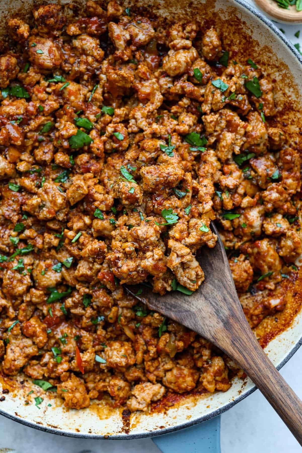 These ground turkey tacos are full of fiesta flavor, all with less fat! Don't let ground turkey steer you away! No one will miss the beef once they taste this taco filling. The seasonings and flavors absorb perfectly into the meat. Overhead shot of cooked ground turkey meat.