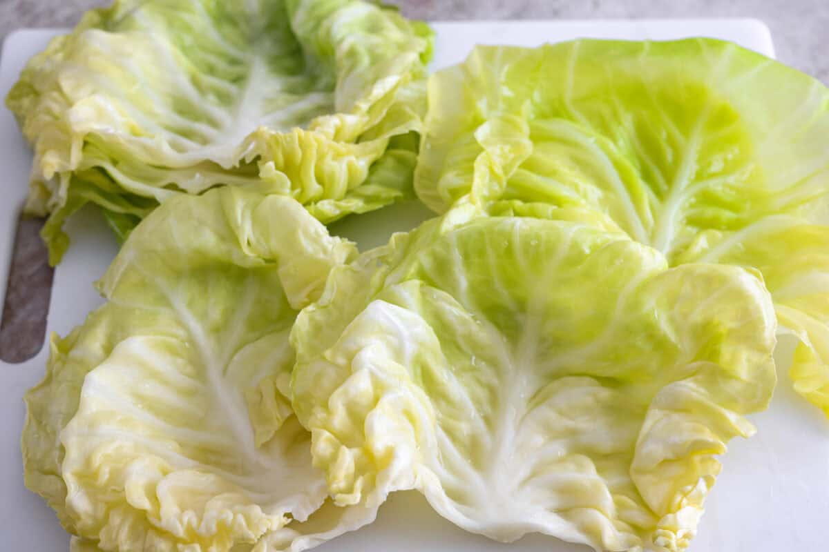 Hungarian cabbage rolls are packed with rich, hearty flavors in every bite! I know you love a good cabbage roll and can’t get enough of my Hungarian goulash, so I knew this recipe would be perfect. Close up shot of the cabbage leaves drying to the side.