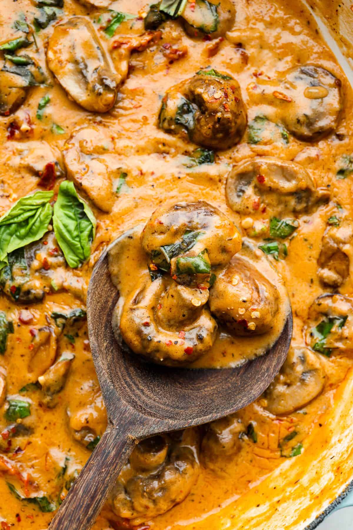 The key to making these Marry Me Mushrooms irresistibly flavorful is getting the perfect sear on the mushrooms. This locks in their natural flavors and texture. Then they simmer in a creamy garlic parmesan sauce with robust sun-dried tomatoes and herbs. It’s a simple technique that makes all the difference! Close up shot of the Marry me mushrooms.