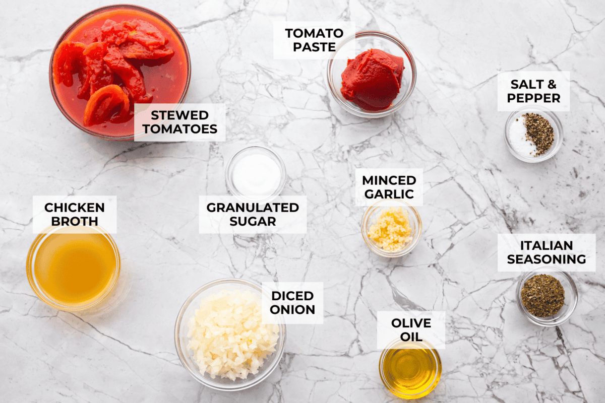 After re-testing this Homemade Marinara Sauce, I can confidently say it’s the BEST! You can make it in 15 minutes, but letting it simmer makes the flavors even better! Overhead shot of labeled ingredients.