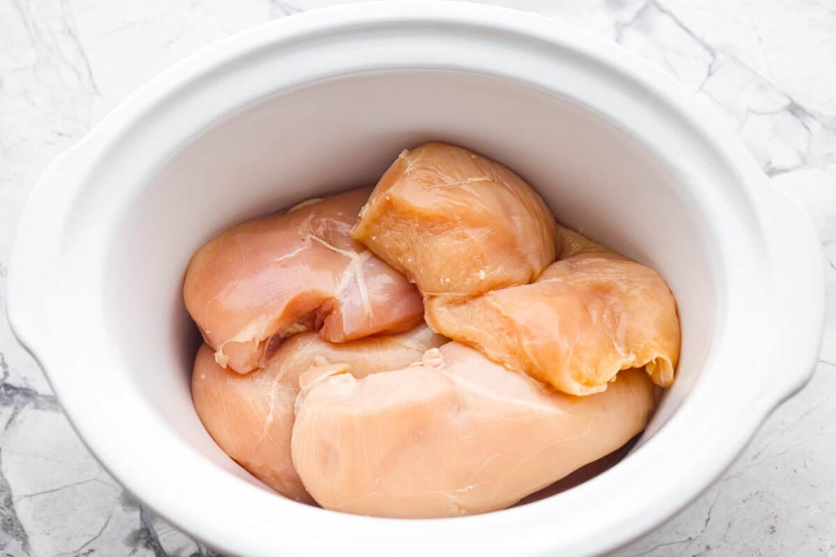 You guys can't get enough of my 3 packet roast, so it's time for a new version, 3 Packet Crockpot Chicken! It takes just 5 minutes to prep and comes out juicy, tender, and full of flavor. Chicken breasts in the bottom of the crockpot.