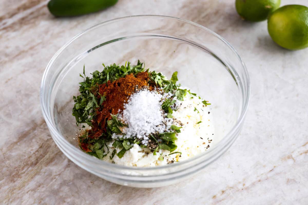 Guys, I’m obsessed with elote, so obviously I had to turn all that smoky, creamy, cheesy, limey magic into a pasta salad big enough to feed a crowd. This one’s guaranteed to disappear fast! Dressing ingredients all added to a bowl.