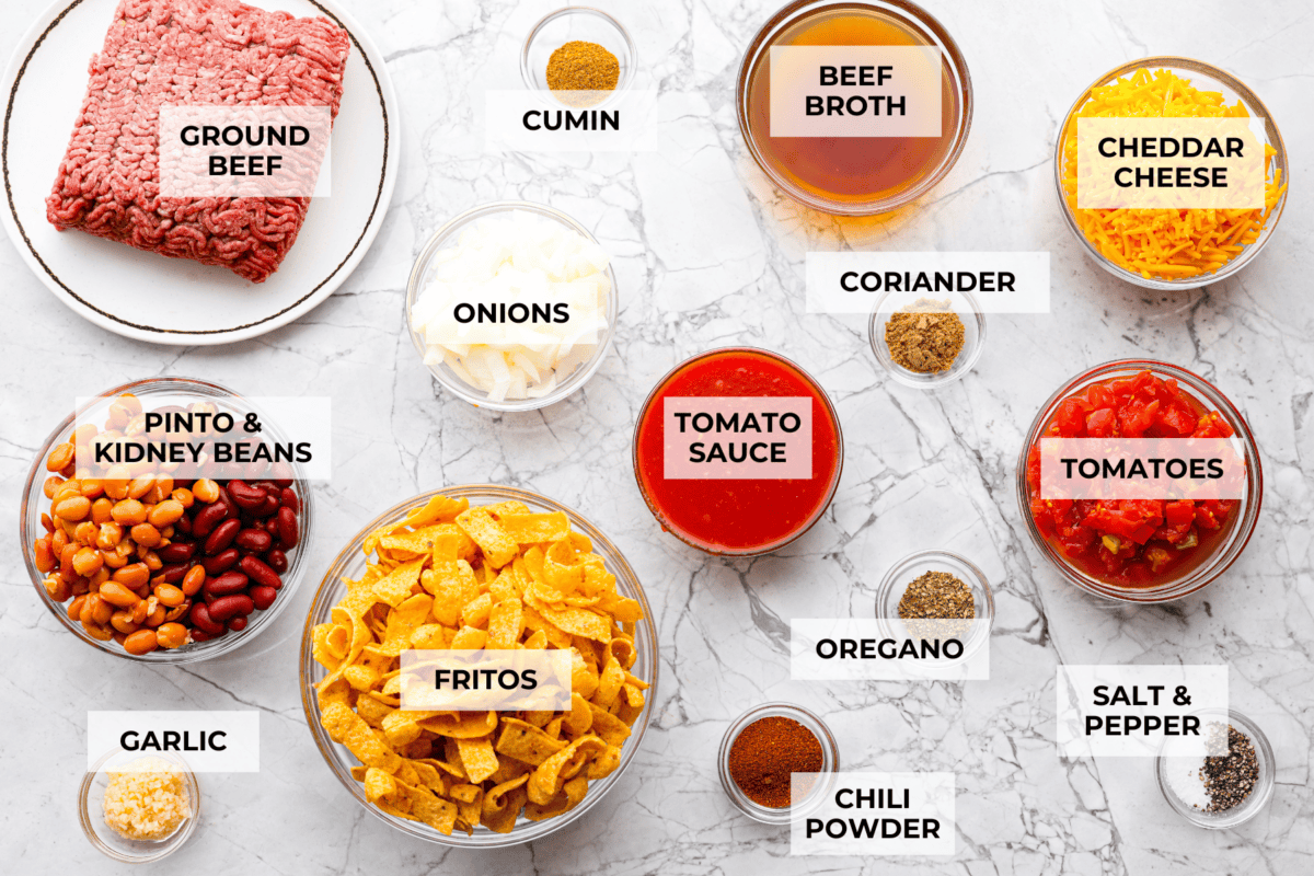 Not to be dramatic, but Frito Chili Pie might have saved my sanity. Zero whining, zero leftovers, it was a total dinner miracle. Crunchy, flavorful and ridiculously easy... you need this in your life ASAP. Overhead shot of labeled ingredients.