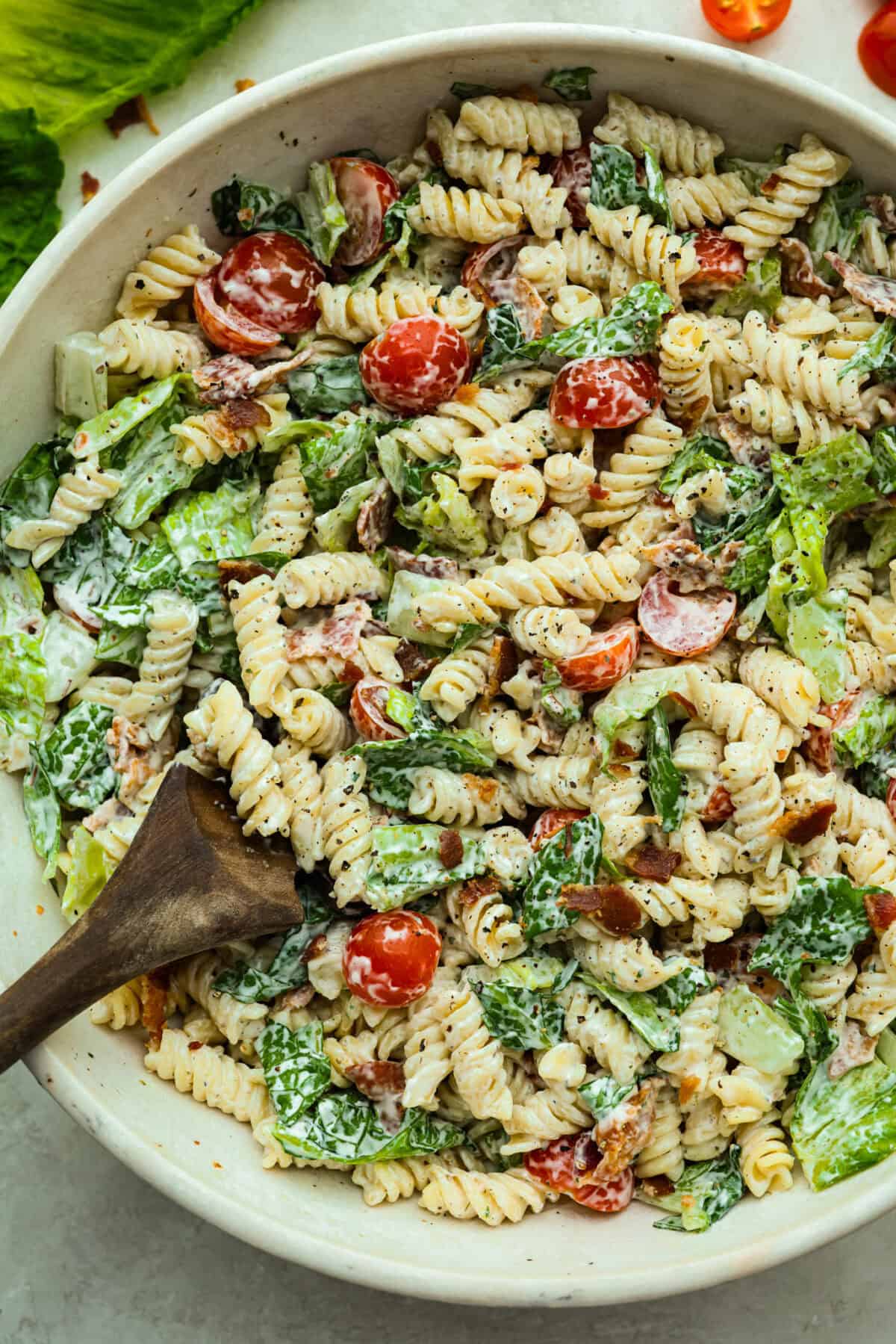 The best sandwich ever? Hands down, a BLT. Add in my obsession with pasta salads and, chef’s kiss! This BLT Pasta Salad has the crispy bacon, juicy tomatoes, and crunchy lettuce we all love! Overhead shot of a big bowl pf BLT pasta salad ready to eat!