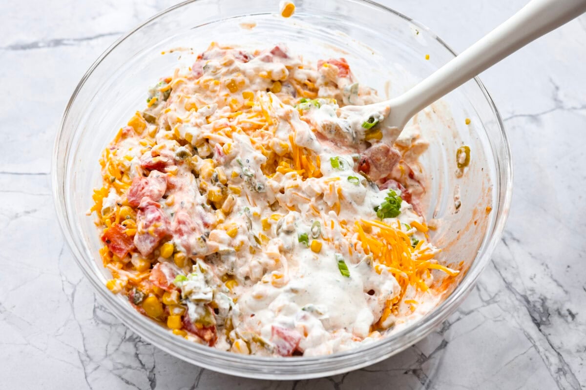 Veggie and cheese mixture mixed with the sauce.