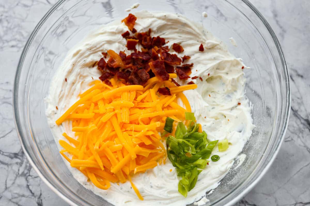 Cheese, bacon, and green onions added to the cream cheese mixture. 