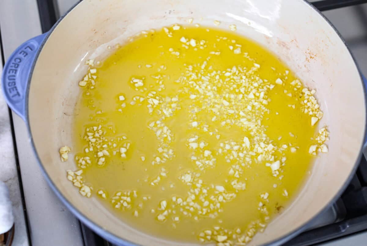 Extra virgin olive oil and garlic in a skillet.