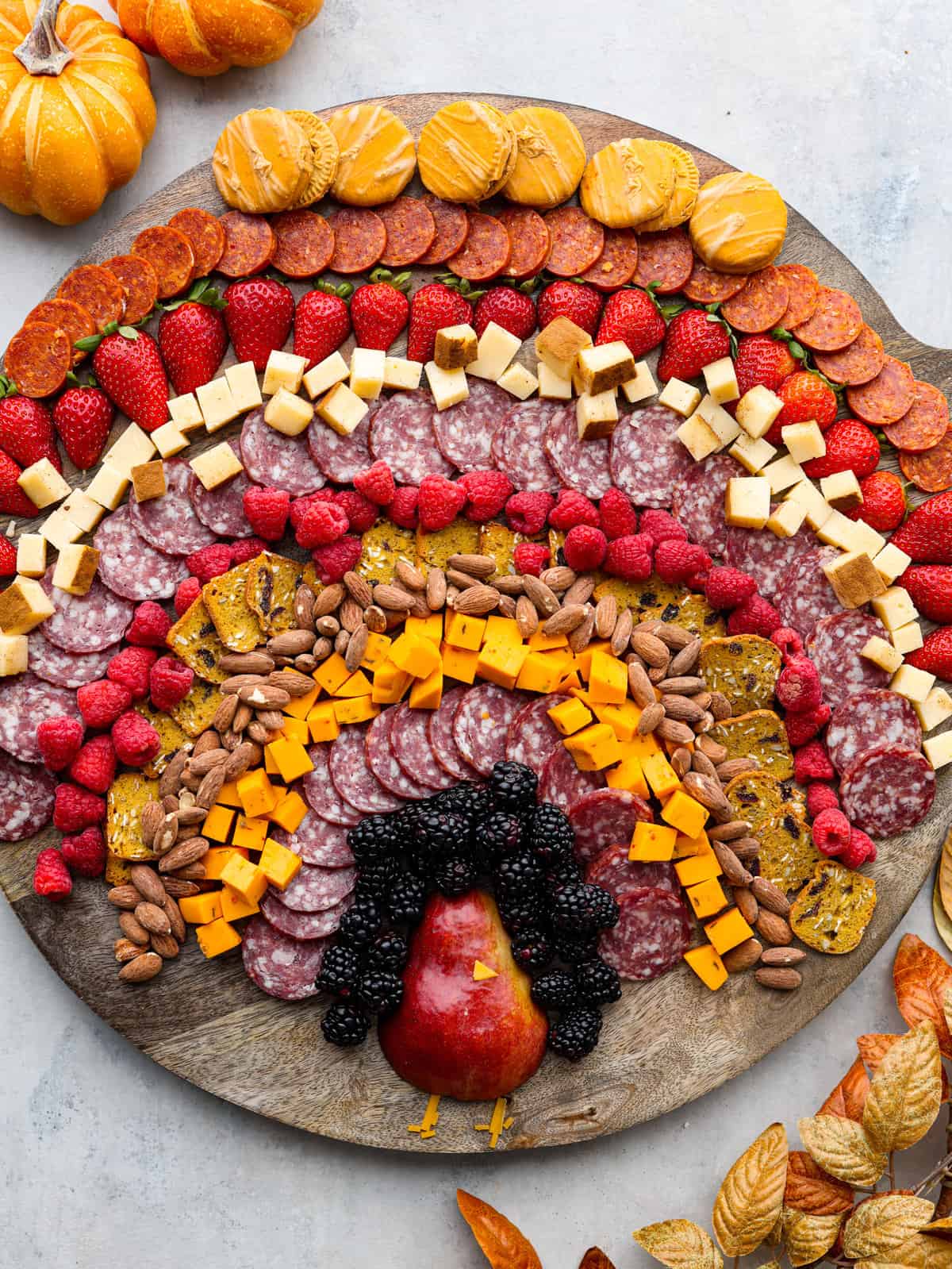 These are easy, make-ahead recipes that look great on the table and buy you a little extra time while the rest of dinner finishes up! Charcuterie board with the ingredients laid out in the shape of a turkey.