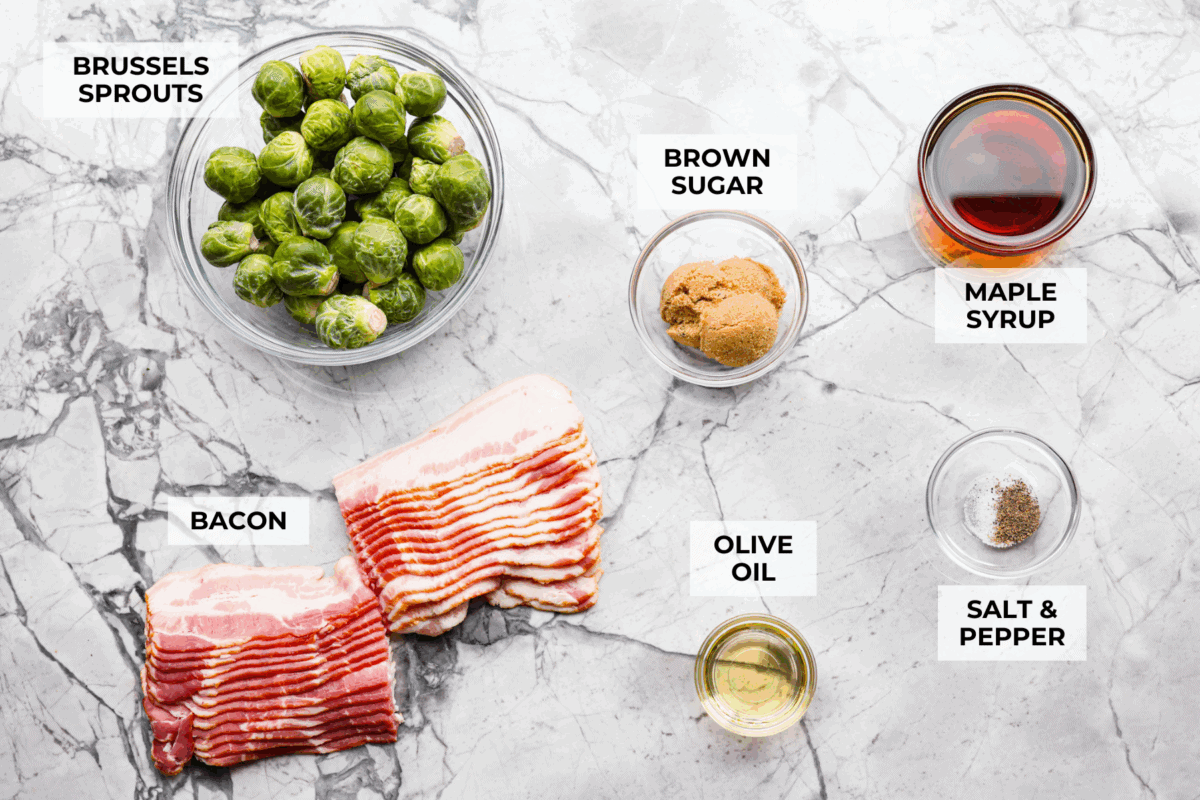 I love bacon. I love Brussels sprouts. Put them together and I’m sold. But the secret to these bacon-wrapped Brussels sprouts? A drizzle of maple syrup! It makes them sweet, smoky, and completely irresistible. Overhead shot of labeled ingredients.