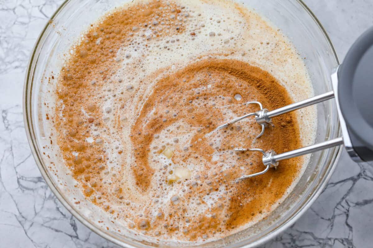 If you love classic bread pudding, you’ve got to try banana bread pudding. Sweet banana flavor, a soft custardy center, and golden edges that taste like heaven. It’s easy to throw together and is perfect for brunch or even dessert! Adding the seasonings and mashed banana to the egg mixture.