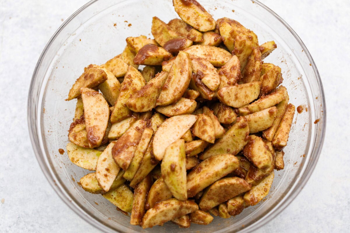 Sugar mixture and apples mixed together to make the brown bag apple pie filling. 