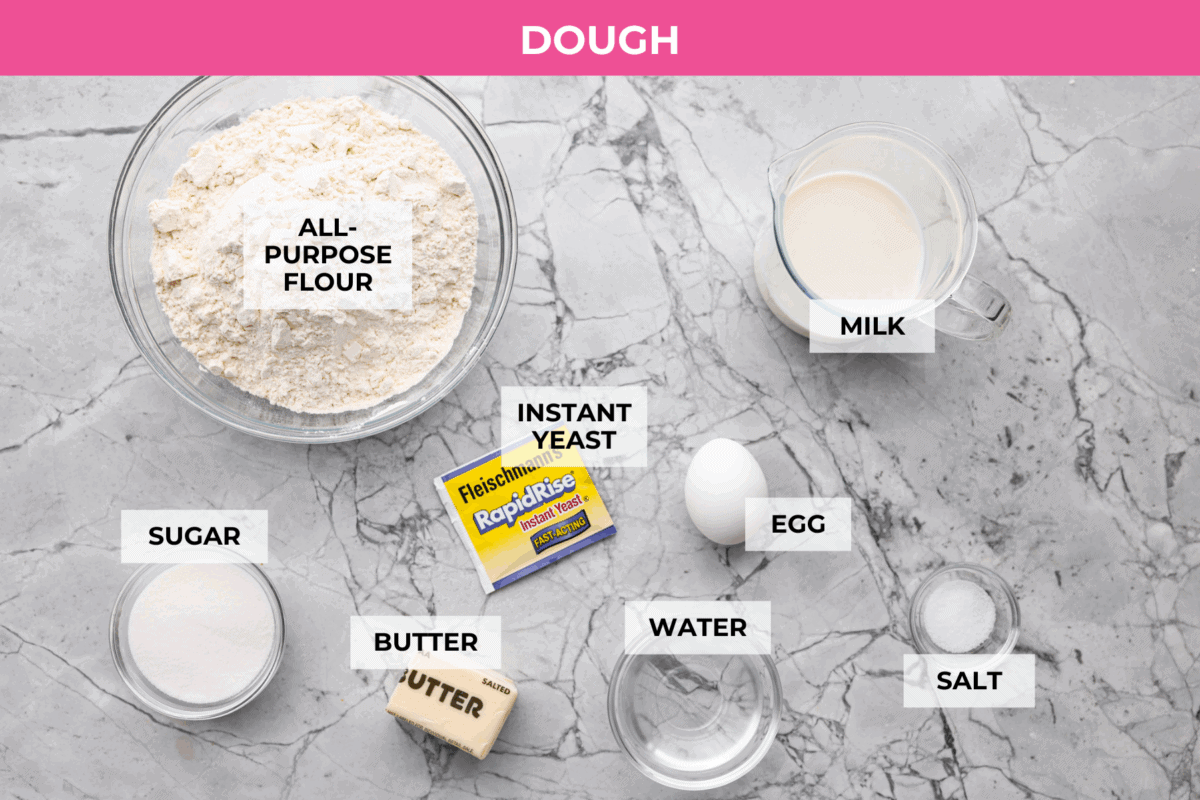 These Caramel Apple Cinnamon Rolls are soft, gooey, and baked with cozy fall flavor in every bite. The homemade dough bakes up perfectly fluffy, and the rich caramel topping makes them feel extra special. Overhead shot of labeled caramel apple cinnamon roll dough ingredients.