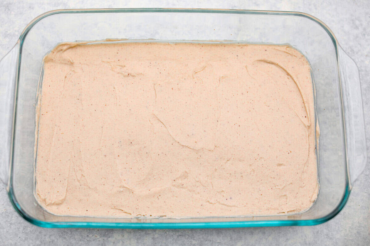 Caramel Apple Pie Lush is the easiest fall dessert you’ll ever make! With layers of buttery crust, creamy cheesecake, spiced apples, caramel, and whipped topping, it’s a yummy fall treat that is so much easier than baking a pie from scratch! Cream cheese layer spread over the graham cracker crust.