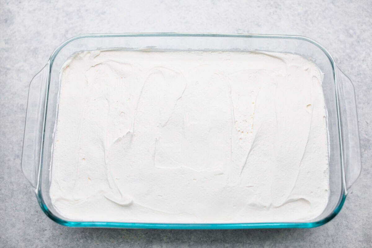 Caramel Apple Pie Lush is the easiest fall dessert you’ll ever make! With layers of buttery crust, creamy cheesecake, spiced apples, caramel, and whipped topping, it’s a yummy fall treat that is so much easier than baking a pie from scratch! Whipped topping layer added to the top of the apple pie filling.