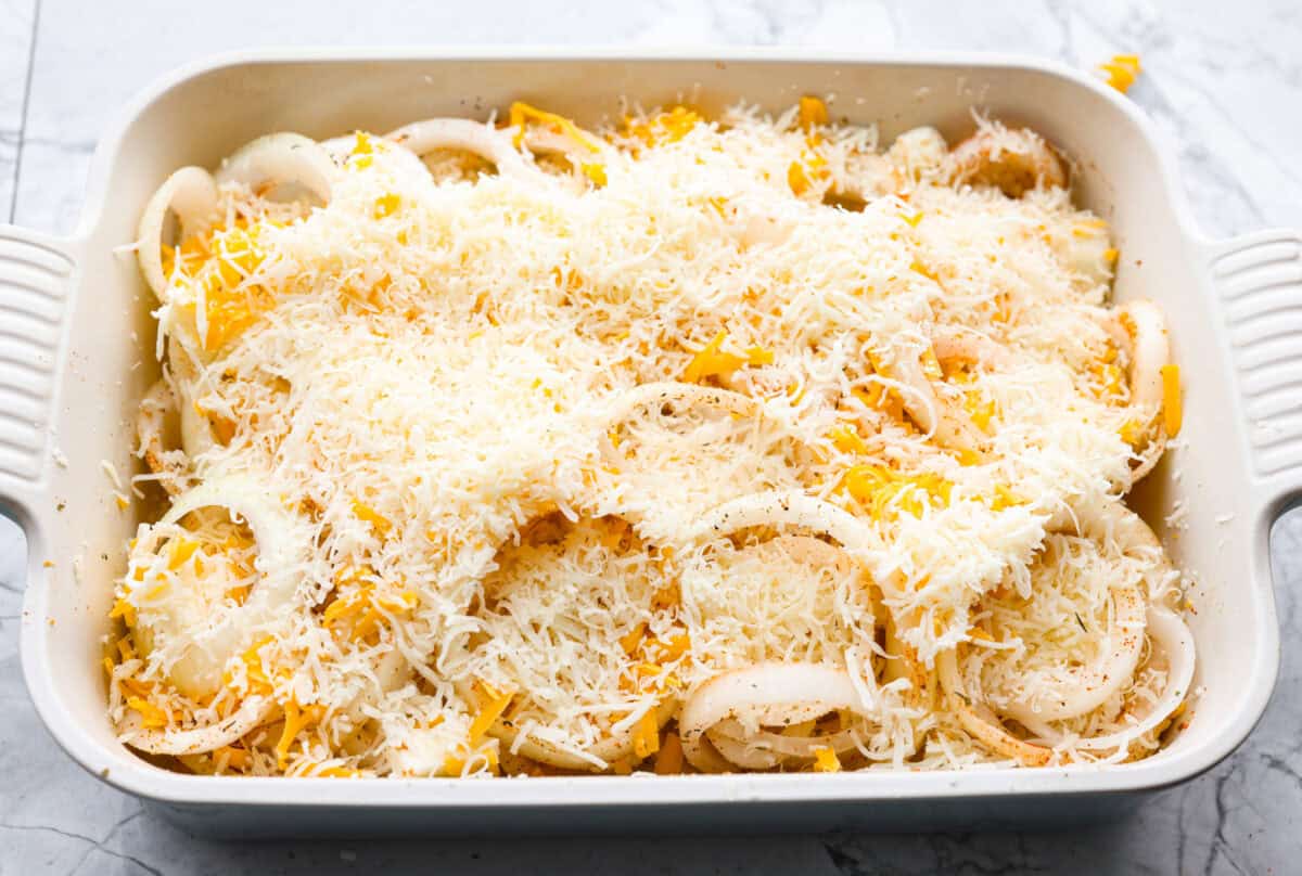 If you’ve never had Tennessee onions, bless your heart! Sweet onions bake in butter and gooey cheese until they’re golden, bubbly, and downright sinful. The perfect side to complement steak, chicken, burgers, or your favorite BBQ. Cheese spread over the top of the onions.